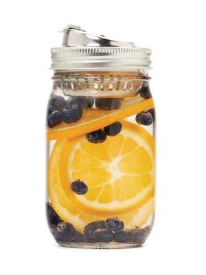 Stainless steel Jarware Fruit Infusion Mason Jar Drink Lid shown on a Regular Mouth Pint Jar with oranges and blueberries in the jar on a white background. 