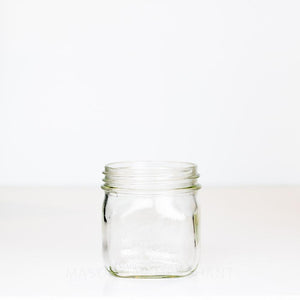 Vintage Dominion Mason Short Square Wide Mouth Pint jar on a white background.