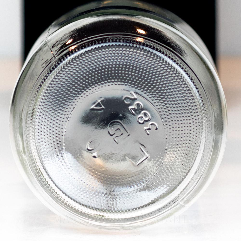 Bottom of a wide mouth mason jar showing the Dominion glass markings, with number 3832