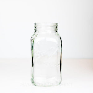 Regular mouth quart mason jar with Dominion Mason logo against a white background 