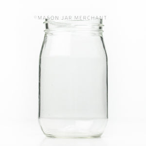 Vintage regular mouth quart mason jar with plain sides, against a white background 